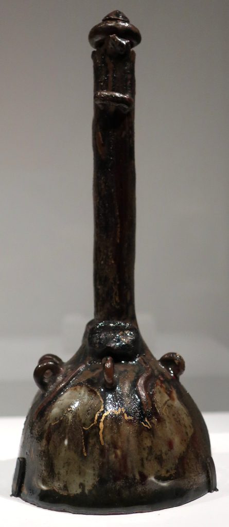Bottle with Two Small Half-Masks by Paul Gauguin